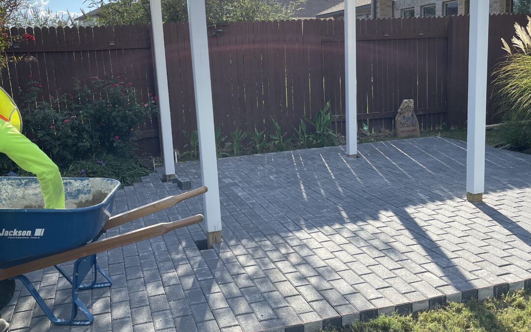 White pergola with patio and pavers in Georgetown Tx